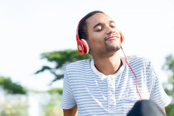 relaxed-young-man-loving-music-enjoying-naturejpg